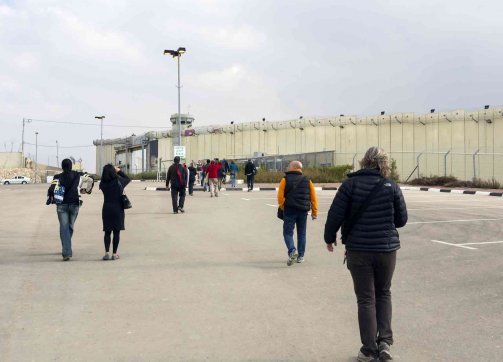Palestinians approach to Checkpoint 300, which controls the passage between Jerusalem and Bethlehem