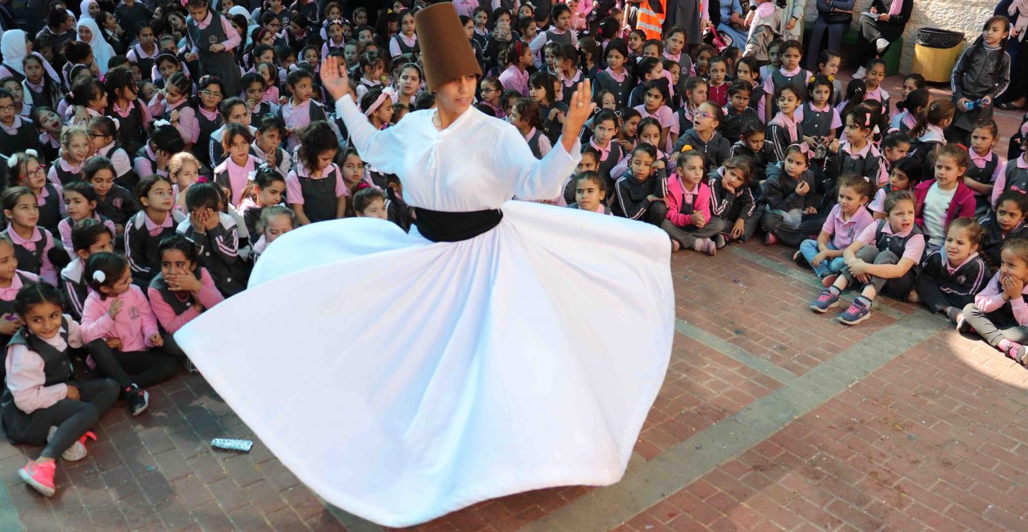 Ashira Ramadan, yoga healer, spins like a whirling dervish for Palestinian girls in Sur Baher, Jerusalem