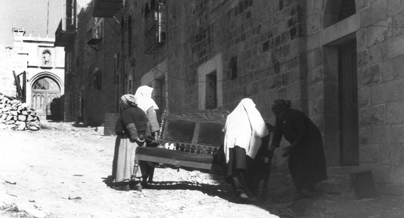 Jewish Israelis looting the depopulated homes of Palestinians in the village of ‘Ayn Karim, west of Jerusalem. 