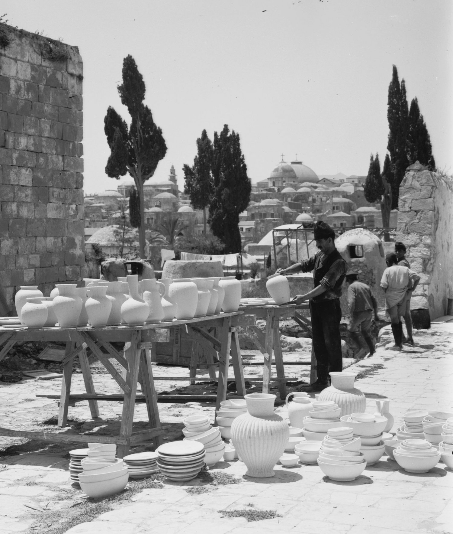 Clay jars and vases drying in the sun outside the Dome of the Rock Tiles workshop, Via Dolorosa, Jerusalem, 1920s